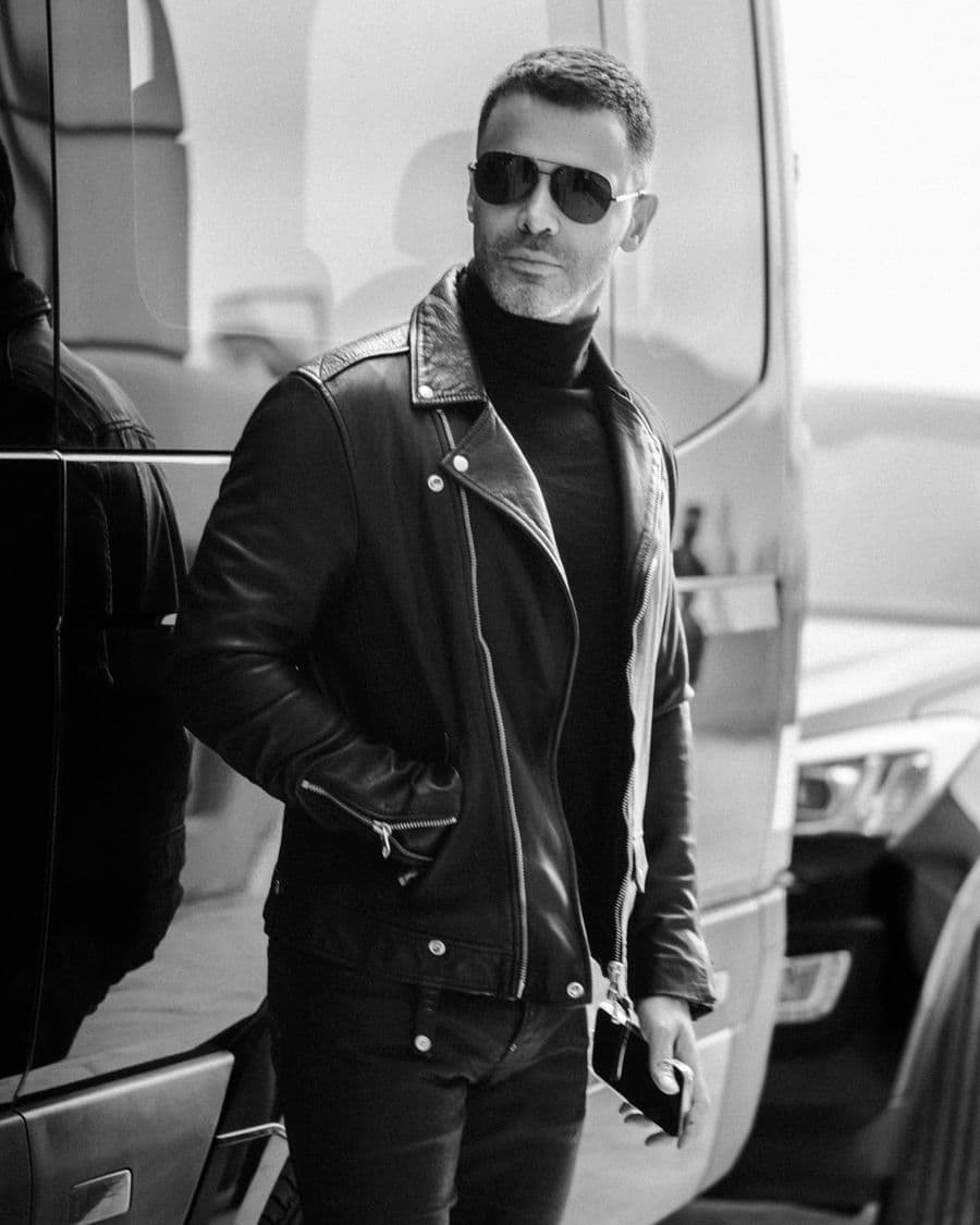 A man in a leather jacket, in black and white